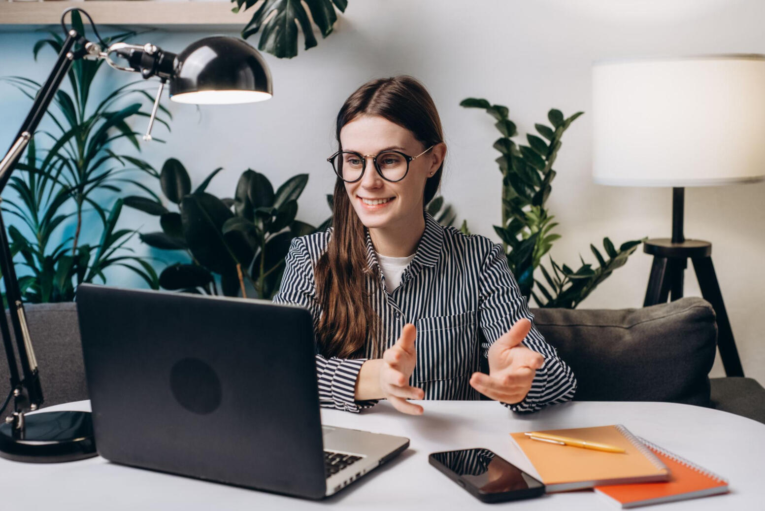 A young professional in an international/modern work environment, ideally something that suggests career progression rather than classroom learning.